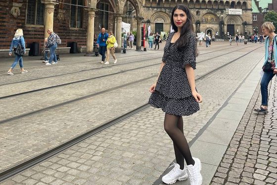 Fatemeh Raeika Vahedi poses in front of a church.