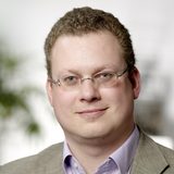 Porträtfoto von Dr. Marcel Schmutzler